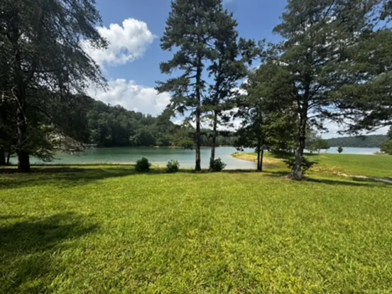 Grassy lawn sloping to Norris Lake